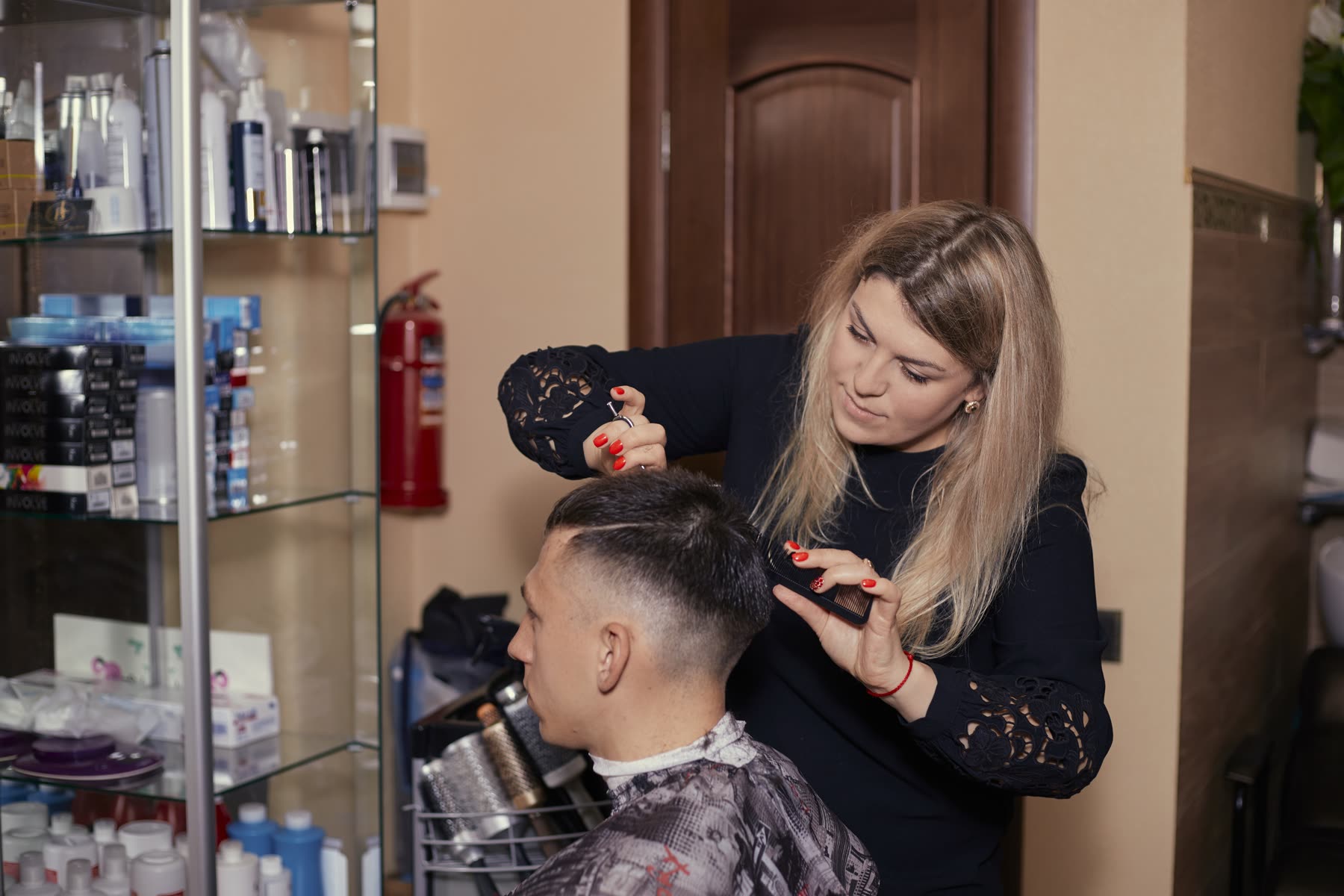 Anne cutting a client's hair in the studio